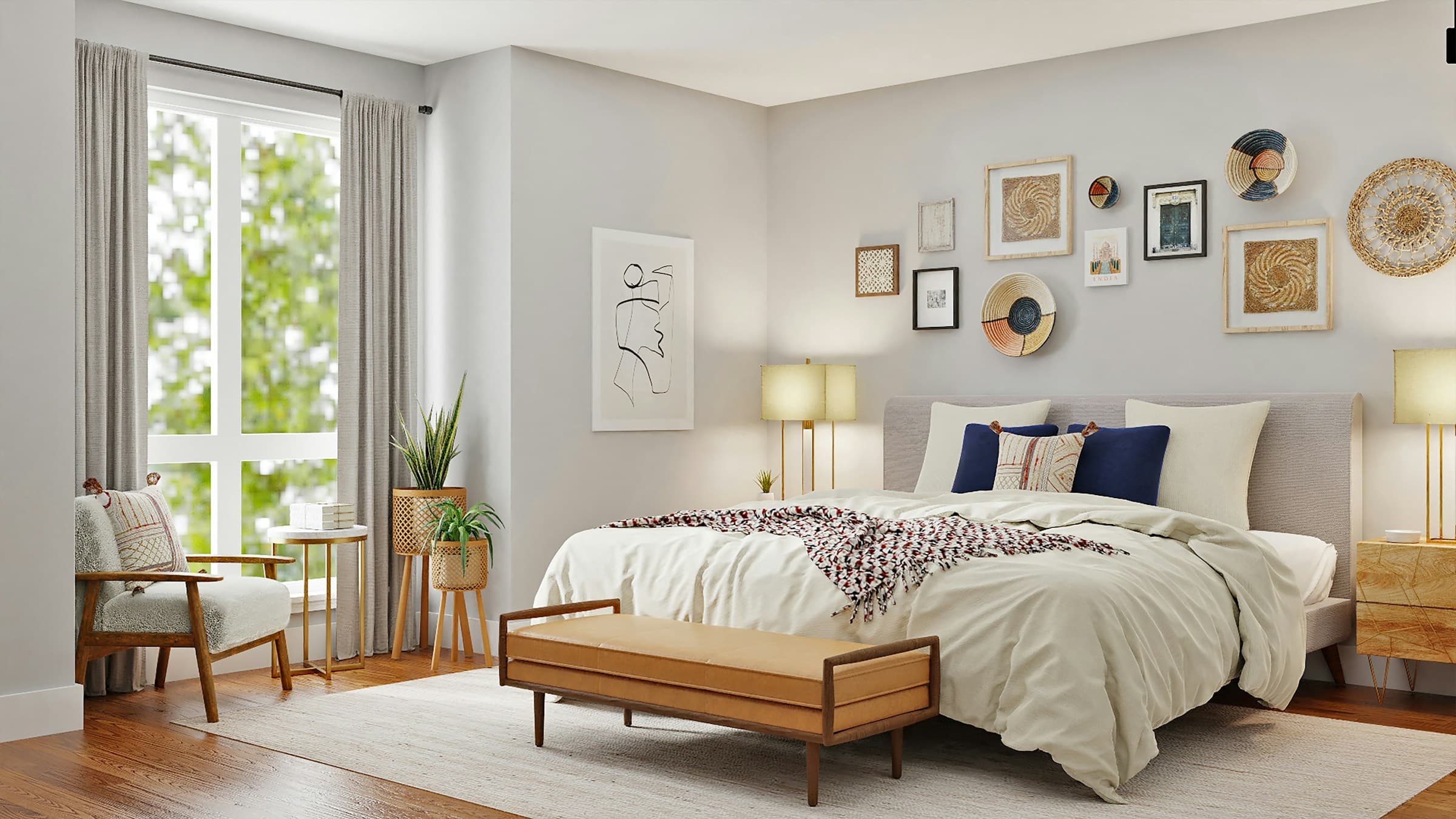 Bright bedroom with soft grey walls, a styled gallery wall and natural window light