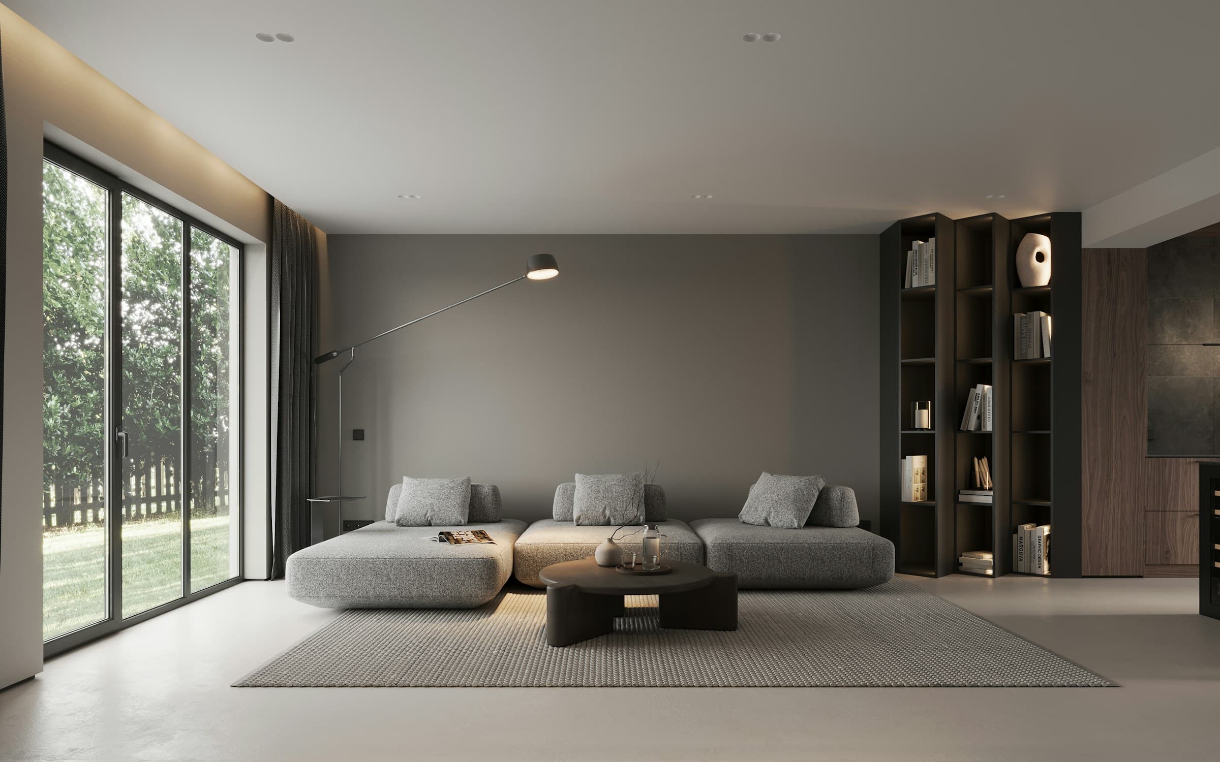 Minimal grey living room with recessed ceiling lights, cove-lit shelving and garden views